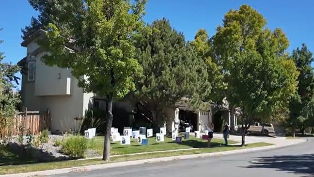 Forever14 signs on Kerri Countess' Sparks yard (KRNV){p}{/p}